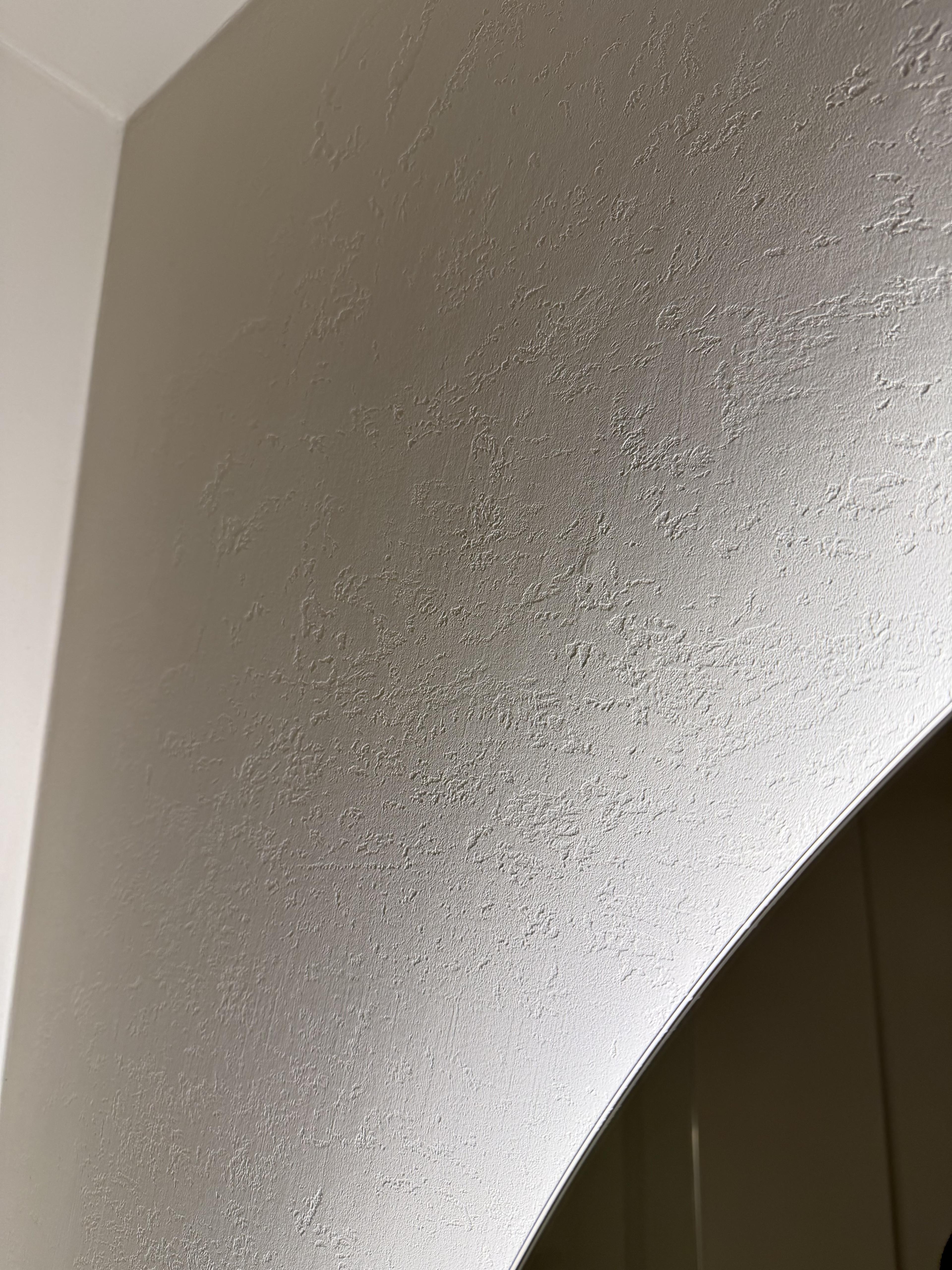 Custom textured microcement finish on bathroom walls and ceiling — St Kilda Penthouse
