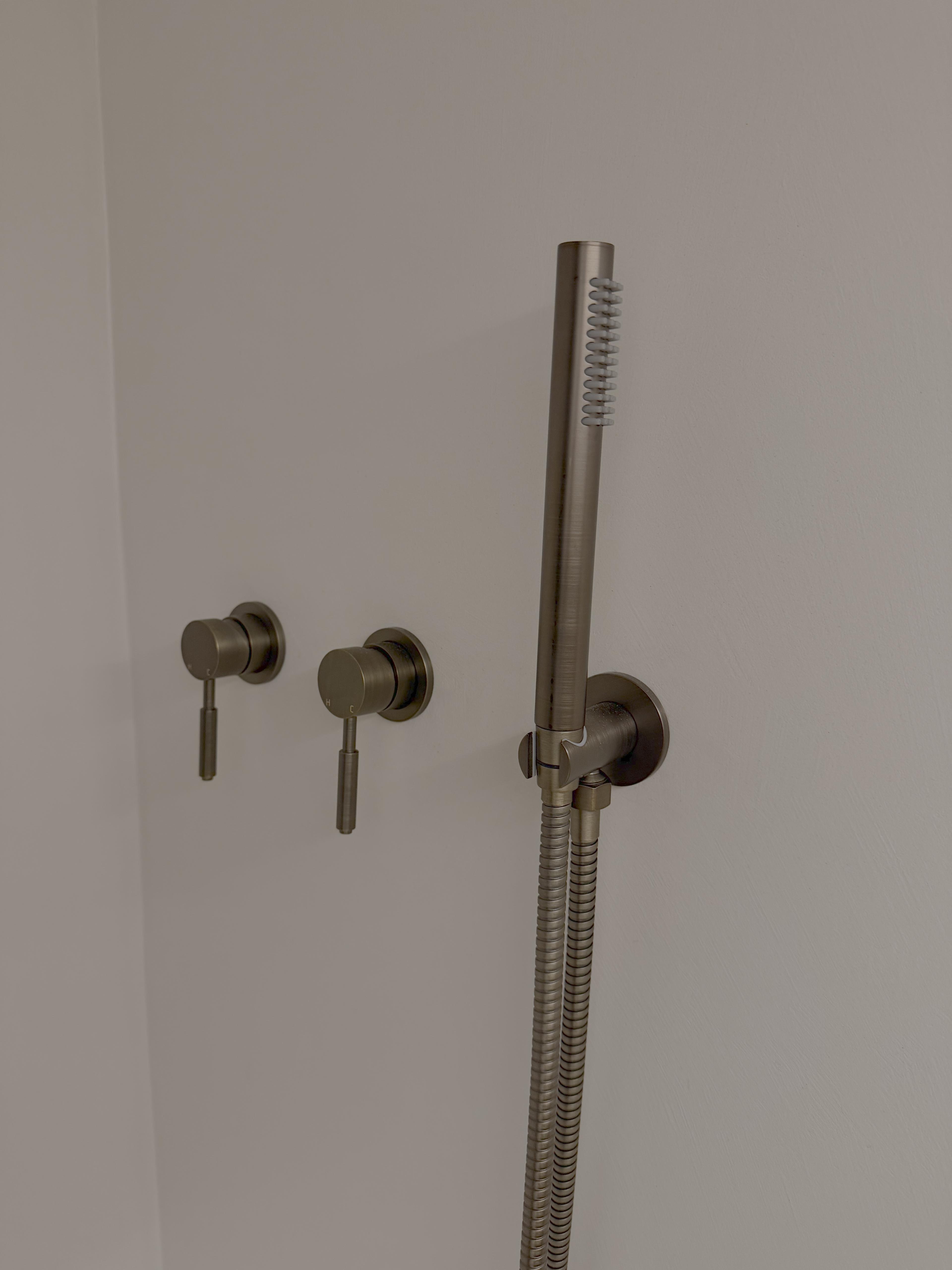 Seamless microcement floor and wall junction in penthouse bathroom — St Kilda Penthouse